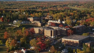 AX149_072 - 5.5K aerial stock footage orbiting Maine Maritime Academy, autumn, Castine, Maine