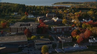 AX149_080E - 5.5K aerial stock footage approaching the Maine Maritime Academy, autumn, Castine, Maine