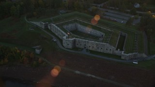 AX149_114 - 5.5K aerial stock footage approaching Fort Knox and tilt down, autumn, Stockton Springs, Maine, sunset