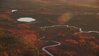 5.5K aerial stock footage flying by small rivers leading to a pond, autumn, Palermo, Maine, sunset Aerial Stock Footage | AX149_196