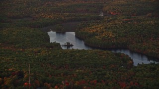 5.5K aerial stock footage flying by colorful foliage, Tolman Pond, autumn, Augusta, Maine, sunset Aerial Stock Footage | AX149_212