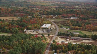 5.5K aerial stock footage flying over real homes, colorful trees, Depot Street, autumn, Buckfield, Maine Aerial Stock Footage | AX150_062