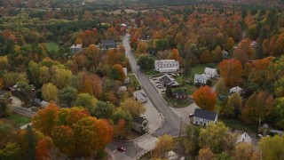 5.5K aerial stock footage flying over small town, rural homes and Union Church, autumn, Buckfield, Maine Aerial Stock Footage | AX150_067E