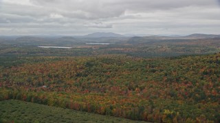 5.5K aerial stock footage flying by colorful forest in autumn, overcast, Norway, Maine Aerial Stock Footage | AX150_108E