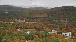 5.5K aerial stock footage orbiting small rural town, dense forest, hills, autumn, overcast, Waterford, Maine Aerial Stock Footage | AX150_121