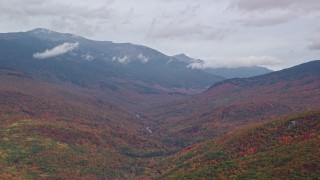 5.5K aerial stock footage flying by Mount Washington, overcast, forest, autumn, White Mountains, New Hampshire Aerial Stock Footage | AX150_184