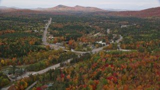 5.5K aerial stock footage flying over Highway 302, forest, approach small town, autumn, Carroll, New Hampshire Aerial Stock Footage | AX150_217E