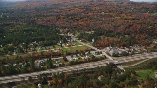 5.5K aerial stock footage approaching small rural town, Interstate 93, autumn, Franconia, New Hampshire Aerial Stock Footage | AX150_240E