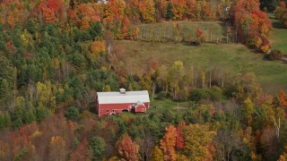 5.5K aerial stock footage flying by a red barn, colorful foliage, autumn, Sugar Hill, New Hampshire Aerial Stock Footage | AX150_254