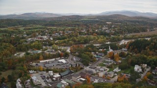 5.5K aerial stock footage flying by rural town, bridge, Ammonoosuc River and Connecticut River, autumn, Woodsville, New Hampshire Aerial Stock Footage | AX150_286E