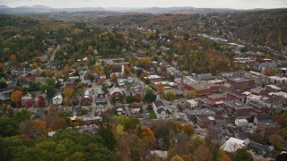 AX150_390 - 5.5K aerial stock footage approaching downtown churches and tilt down, autumn, Montpelier, Vermont