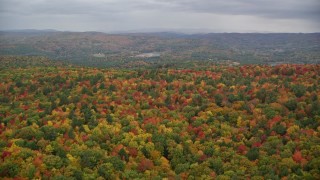 5.5K aerial stock footage flying over densely forested hills, autumn, White River Junction, Vermont Aerial Stock Footage | AX151_002E