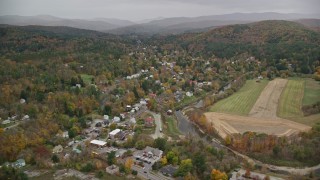 5.5K aerial stock footage flying over forest, Blake Hill, reveal, small rural town, autumn, Woodstock, Vermont Aerial Stock Footage | AX151_011E