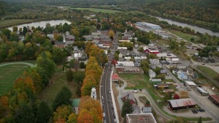 AX151_061E - 5.5K aerial stock footage flying over Main Street through small rural town, autumn, Windsor, Vermont