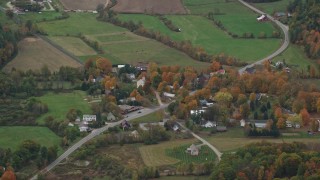 5.5K aerial stock footage flying by small rural town, grassy clearings, foliage, autumn, Cornish, New Hampshire Aerial Stock Footage | AX151_069E