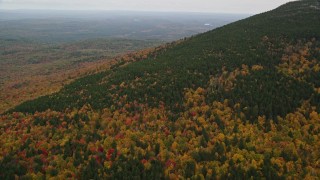 5.5K aerial stock footage flying over colorful forest, Mount Kearsarge, autumn, Wilmot, New Hampshire Aerial Stock Footage | AX151_112