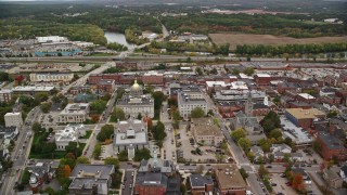 AX151_183E - 5.5K aerial stock footage orbiting downtown, New Hampshire State House, autumn, Concord, New Hampshire