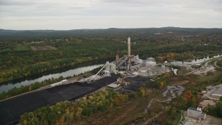 5.5K aerial stock footage flying over Merrimack River, approaching a power plant, autumn, Bow, New Hampshire Aerial Stock Footage | AX152_004E