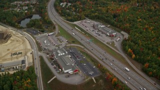 5.5K aerial stock footage approaching strip malls, Interstate 93, tilt down, autumn, Bow, New Hampshire Aerial Stock Footage | AX152_008E