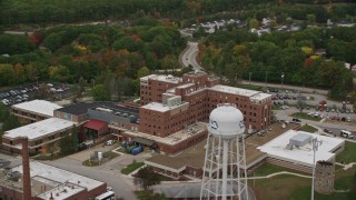 5.5K aerial stock footage flying by Veterans Affairs Medical Center, autumn, Manchester, New Hampshire Aerial Stock Footage | AX152_036E