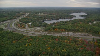 5.5K aerial stock footage flying by Interstate 93, Cobbetts Pond, autumn, Windham, New Hampshire Aerial Stock Footage | AX152_068