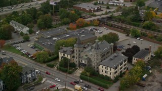 5.5K aerial stock footage flying by a condominium complex and busy street, autumn, Lowell, Massachusetts Aerial Stock Footage | AX152_141E