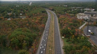 5.5K aerial stock footage flying over highway lined with fall foliage, autumn, Billerica, Massachusetts Aerial Stock Footage | AX152_160E