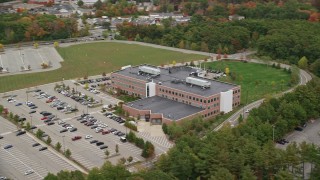 5.5K aerial stock footage orbiting away from an office building and parking lot, autumn, Burlington, Massachusetts Aerial Stock Footage | AX152_166