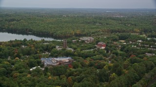 AX152_179 - 5.5K aerial stock footage flying by Green Hall, colorful foliage in autumn, Wellesley College, Massachusetts