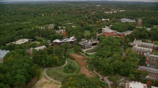 AX152_183 - 5.5K aerial stock footage orbiting Wang Campus Center, autumn, Wellesley College, Massachusetts