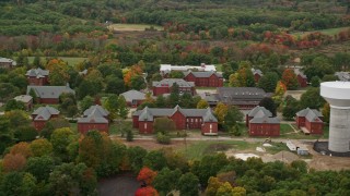 AX152_190E - 5.5K aerial stock footage approaching Medfield State Hospital, autumn, overcast, Medfield, Massachusetts