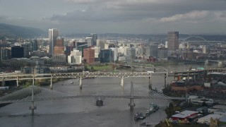 5.5K aerial stock footage crossing the Willamette River with views of the city skyline, autumn, Downtown Portland, Oregon Aerial Stock Footage | AX153_051E