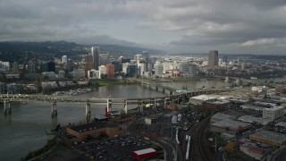 AX153_053E - 5.5K aerial stock footage approach and fly over Marquam and Hawthorne Bridge toward skyline, Downtown Portland, Oregon