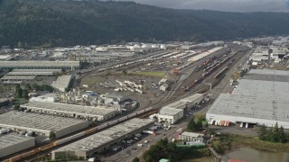 5.5K aerial stock footage passing a train yard, Northwest Portland, Oregon Aerial Stock Footage | AX153_060