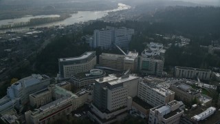 AX153_119E - 5.5K aerial stock footage approaching and fly over the Oregon Health and Science University in Portland, Oregon