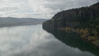 5.5K aerial stock footage approaching an isolated home and railroad tunnel in Columbia River Gorge, Washington Aerial Stock Footage | AX154_008