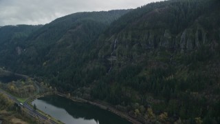 5.5K aerial stock footage approaching a waterfall on a Columbia River Gorge cliff in Multnomah County, Oregon Aerial Stock Footage | AX154_017E