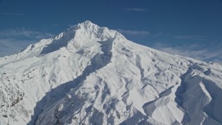 AX154_081E - 5.5K aerial stock footage of Mount Hood with snowy slopes, Mount Hood, Cascade Range, Oregon