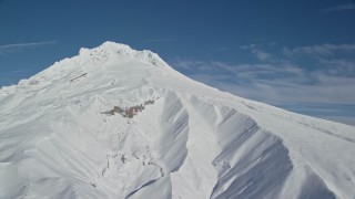 5.5K aerial stock footage of Mount Hood covered in snow, Mount Hood, Cascade Range, Oregon Aerial Stock Footage | AX154_084E