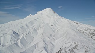 5.5K aerial stock footage of snow-covered mountain slopes of Mount Hood, Cascade Range, Oregon Aerial Stock Footage | AX154_096