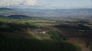 5.5K aerial stock footage of a view across farms in Hood River, Oregon Aerial Stock Footage | AX154_149