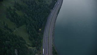 5.5K aerial stock footage of a bird's eye view of light traffic on Interstate 84 in Columbia River Gorge, Hood River County, Oregon Aerial Stock Footage | AX154_159E