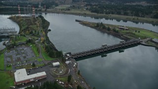 AX154_178 - 5.5K aerial stock footage tracking on the Bonneville Dam in the Columbia River Gorge