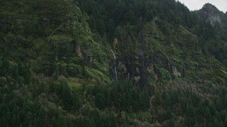 5.5K aerial stock footage of a waterfall on steep green cliffs on the Oregon side of Columbia River Gorge Aerial Stock Footage | AX154_187