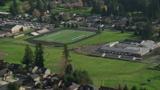 AX154_204 - 5.5K aerial stock footage orbiting Gause Elementary and the Washougal High School football field in Washougal, Washington