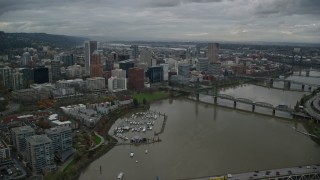 5.5K aerial stock footage flying over Marquam Bridge near Riverplace Marina and Hawthorne Bridge to pass skyscrapers in Downtown Portland, Oregon Aerial Stock Footage | AX155_049E