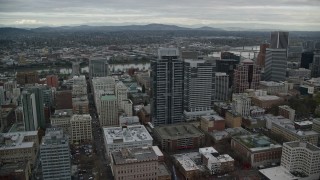 5.5K aerial stock footage flying over Park Avenue West Tower, and tilt to reveal Pioneer Courthouse Square in Downtown Portland, Oregon Aerial Stock Footage | AX155_074E