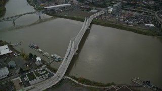 5.5K aerial stock footage of Tilikum Crossing bridge and the Willamette River in South Portland, Oregon Aerial Stock Footage | AX155_077E