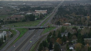 5.5K aerial stock footage following Highway 26 with light traffic through Hillsboro, Oregon, twilight Aerial Stock Footage | AX155_128