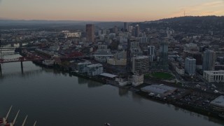 5.5K aerial stock footage orbiting the Fremont Bridge with very heavy traffic at twilight, to reveal Downtown Portland, Oregon Aerial Stock Footage | AX155_182E